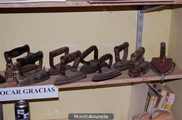 Planchas de carbón, de fundición, electricas, etc.