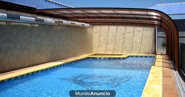 Cubierta para su piscina corredera para cuando se dispone de poco espacio. Piscina cubierta climatizada con cerramiento