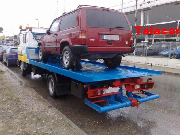 NISSAN L 80 GRUA PORTACOCHES PLATAFORMA DESLIZANTE Y CUCHCARA