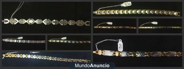 Pulseras en acero inoxidable con baño en oro,bolsos, monederos