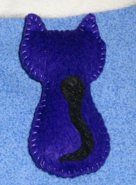 Broche gato por detras