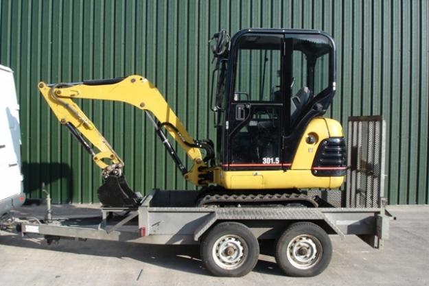 2005 Caterpillar 301.5 Miniexcavadora, 3 cubos y remolque
