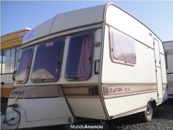 CARAVANA ECONOMICA SWIFT, 4,5 METROS DE CAJA. BUEN ESTADO. 4 PLAZAS 1 COMEDOR GIGANTE CONVERTIBLE EN CAMA,CALEFACCIÓN. A