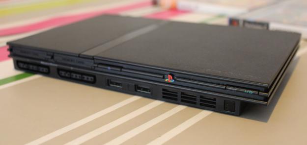 Playstation 2 slim + 5 juegos