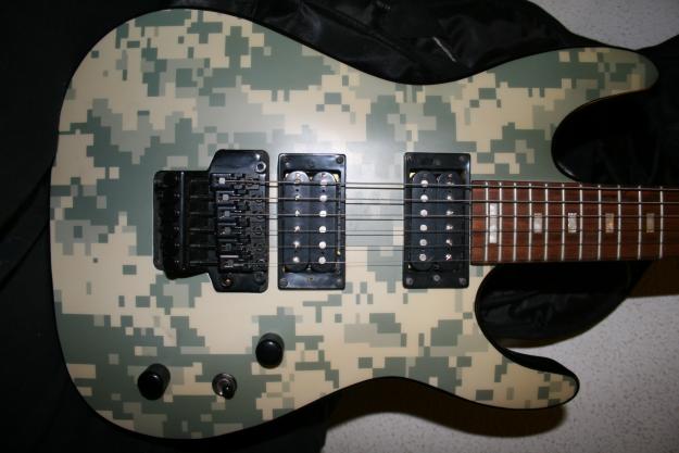 Guitarra electrica Dean Vendetta 2.0 Floyd Rose CAMO + ampli+ funda