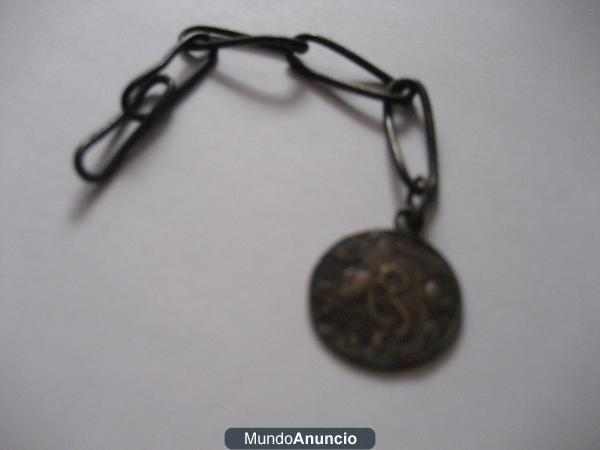 Medalla muy antigua encontrada en ruinas Romanas.