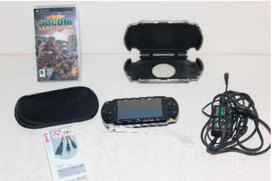 PSP sin apenas uso con accesorios y un juego