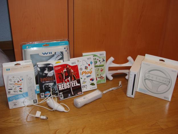 Consola wii+5juegos originales+2mandos+2volantes+pistola