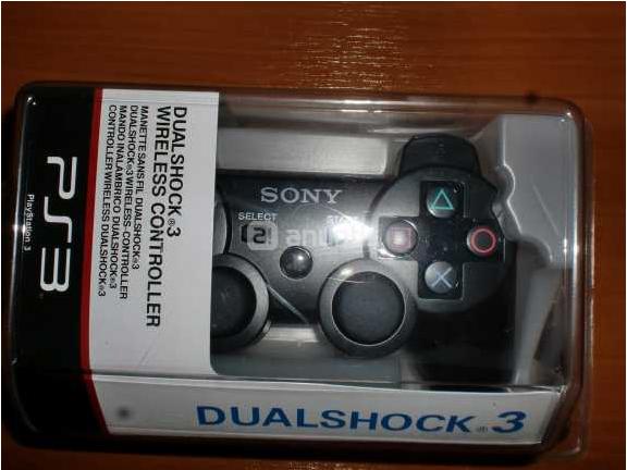 Mando original PS3 y base cargadora a estrenar ambos