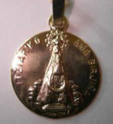 Medallas de virgenes y santos en oro y plata