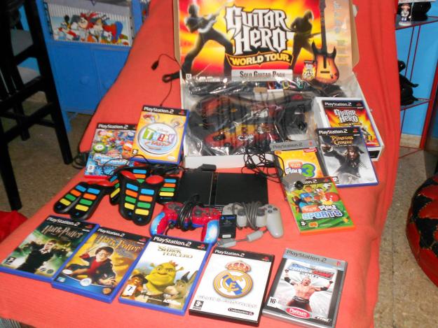 Ps2,Cámara,memory card, 8mandos buzz, guitar hero y 10 juegos