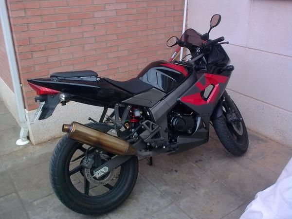 vendo o cambio kymco quannon 125 por coche