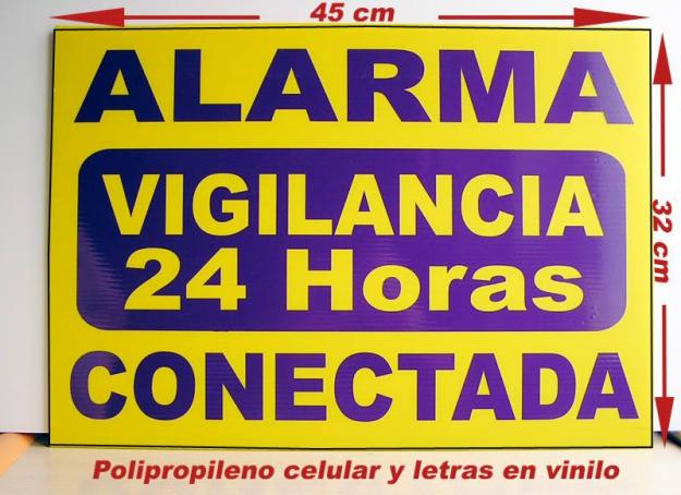 Carteles de Alarma y camara de vigilancia