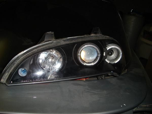 100   - Angel Eyes delanteros negros para Opel Tigra A